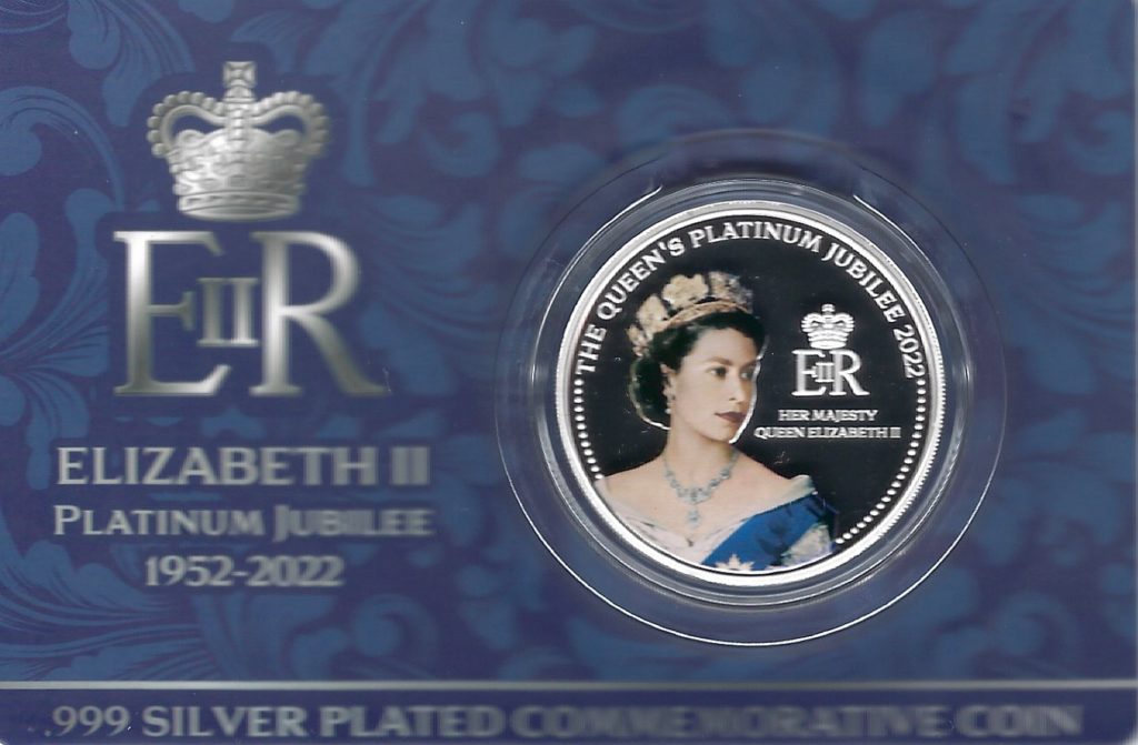 A small card holding with a .999 silver-plated commemorative coin in honor of Elizabeth II's Platinum Jubilee. 